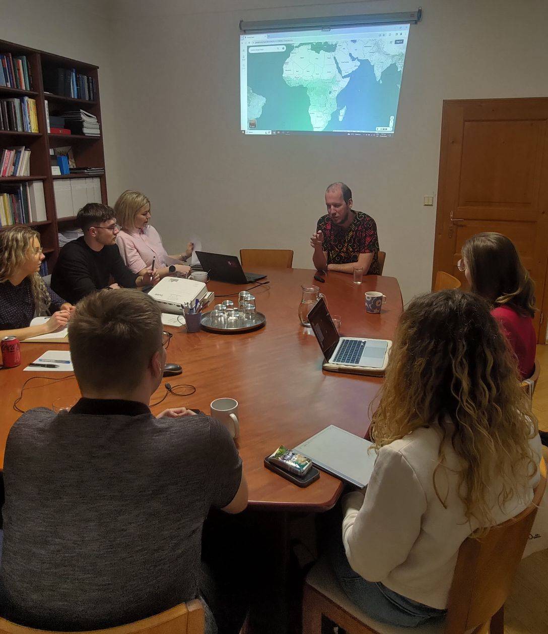 Students attending a projected lecture, from the summer school image archive